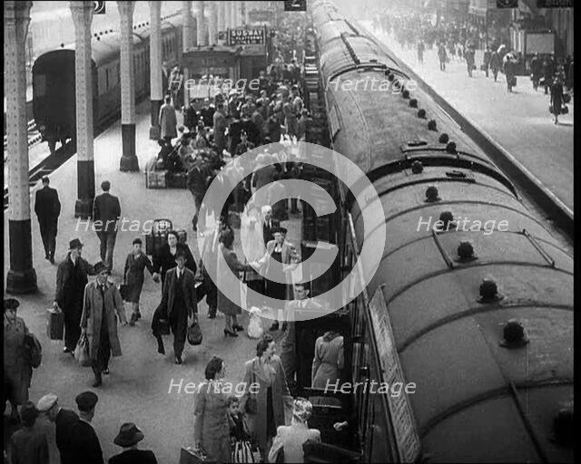 People at  a Train Station, 1933. Creator: British Pathe Ltd.