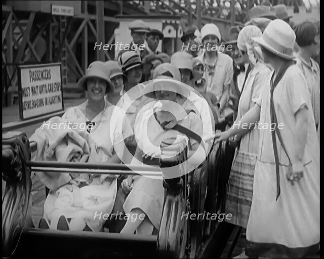 A Large Group of Female Civilians Enjoying  a Roller Coaster Ride, 1926. Creator: British Pathe Ltd.