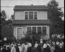 Small Crowd of American Civilians Gathering Outside Bruno Richard Hauptman's House in the..., 1930s. Creator: British Pathe Ltd.