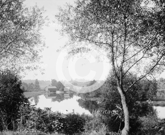 Buildings by river, probably the Huron River, Ypsilanti, Michigan, between 1900 and 1910. Creator: Unknown.
