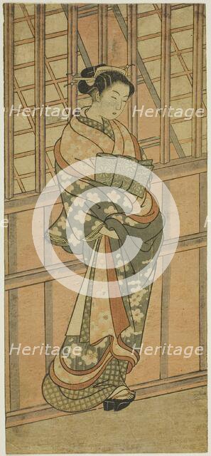 Courtesan Standing in Front of a Barred Window, c. 1765. Creator: Ishikawa Toyonobu.