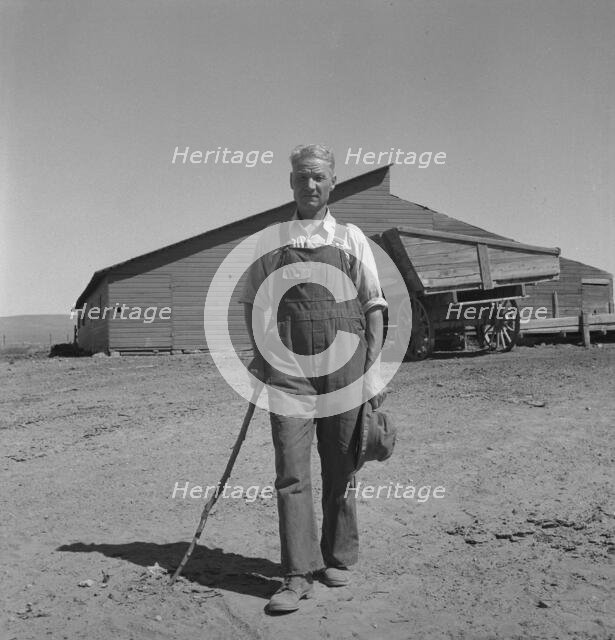 Chris Ament, on dry land wheat farm of Columbia Basin where..., south of Quincy, Washington, 1939. Creator: Dorothea Lange.
