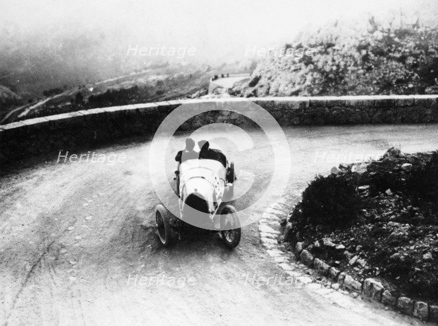 Louis Chiron driving a Bugatti at a hill climb, 1923. Artist: Unknown
