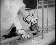 Female Civilian Wearing a Smart Heeled Pair of Shoes in Stripes, 1920. Creator: British Pathe Ltd.