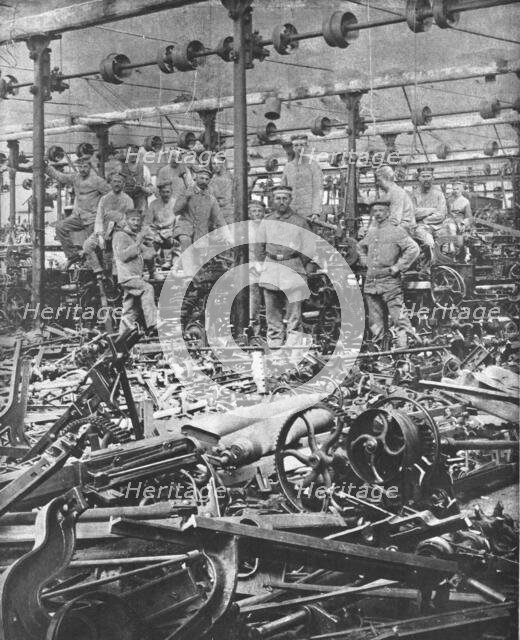 'La Suppression de L'Industrie Francaise; la destruction au Marteau des metiers du tissage..., 1917. Creator: Unknown.