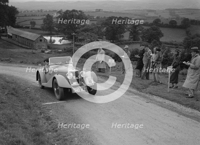 Riley Sprite 2-seater of Mrs TB Hague competing in the South Wales Auto Club Welsh Rally, 1937 Artist: Bill Brunell.