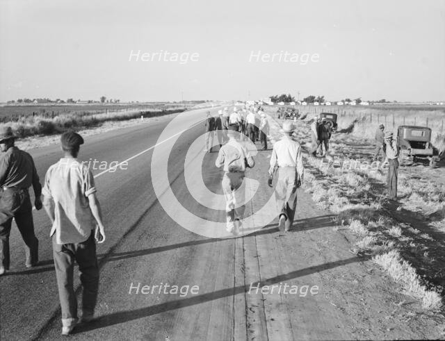Migratory agricultural workers - cotton hoers, near Los Banos, California, 1939. Creator: Dorothea Lange.
