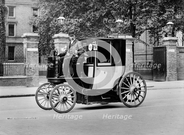 An electric motor cab and driver, London, c1897-c1900. Artist: York & Son.