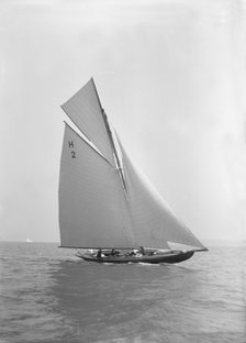 'Verbena' (H2), a gaff rig 8 Metre, sailing close-hauled, 1911. Creator: Kirk & Sons of Cowes.