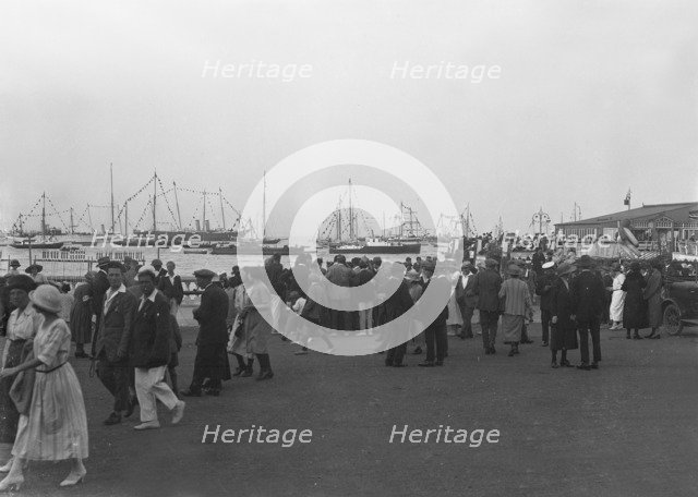 Crowds on the water front during a regatta, c1930. Creator: Kirk & Sons of Cowes.