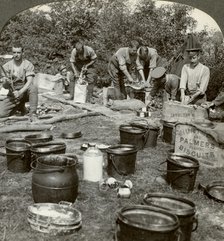 Army cooks preparing a meal, World War I, 1914-1918.Artist: Realistic Travels Publishers
