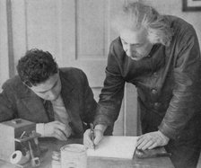 Albert Einstein, German-Swiss-American mathematician and physicist, with a student. Artist: Unknown