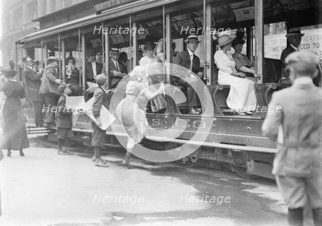 Entering street car ?, between c1910 and c1915. Creator: Bain News Service.