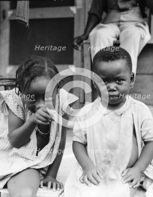 Children of evicted sharecropper, now living on Sherwood Eddy cooperative plantation, 1936. Creator: Dorothea Lange.