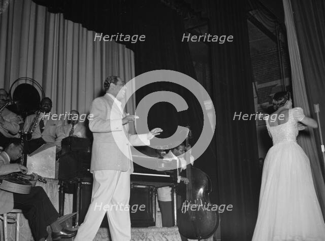 Portrait of Duke Ellington, Barney Bigard, Ben..., Howard Theater(?), Washington, D.C., 1938. Creator: William Paul Gottlieb.