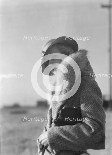 Hamilton, Esther, standing outdoors, 1933 May. Creator: Arnold Genthe.