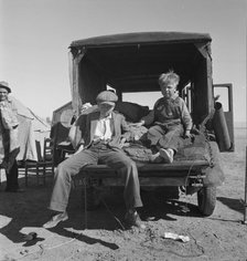 Children of Oklahoma migrants in agricultural workers' camp near Calipatria, California, 1937. Creator: Dorothea Lange.
