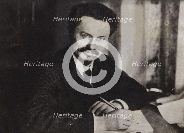 Le?on Trotsky at his writing desk , Early 1920s. Creator: Anonymous.