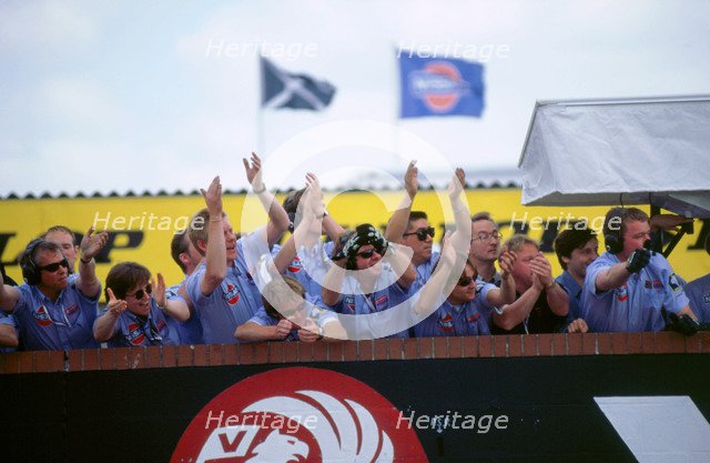Nissan team celebrate victory 1998 British touring cars.. Artist: Unknown.