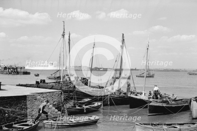 Men working on Bawley boats moored at a quay at Gravesend, c1945-c1965. Artist: SW Rawlings