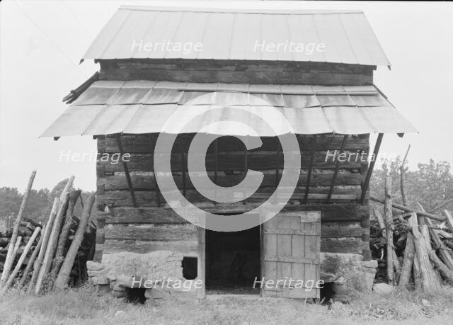 Tobacco barn with front shelter, Olive Hill, North Carolina, 1939. Creator: Dorothea Lange.
