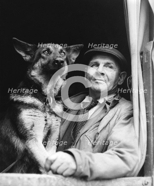 Gypsy man with dog, 1960s.