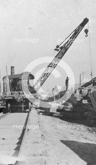 Crane being used in construction of new railway bridge, between c1900 and c1930. Creator: Unknown.