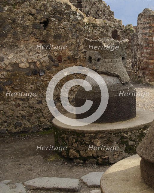 Millstone in the pistrinum, (bakery), Pompeii, Italy, 2009.  Creator: LTL.
