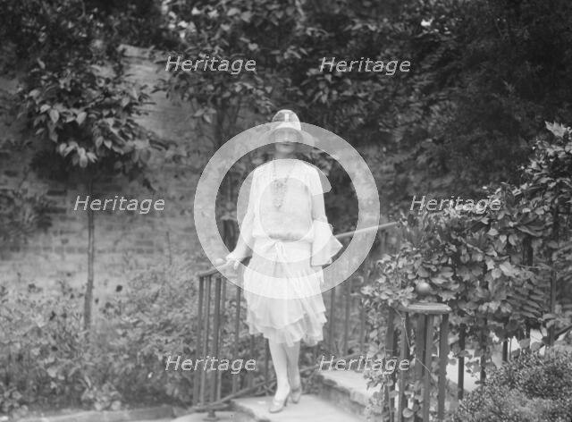 Unidentified woman, standing outdoors, c1920s. Creator: Arnold Genthe.
