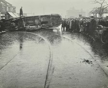Overturned electric tram and onlookers, London, 1913. Artist: Unknown.
