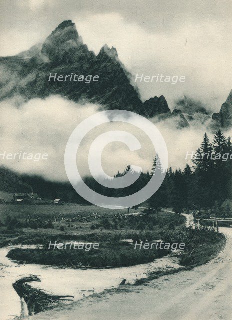 Pala Group in clouds, San Martino di Castrozza, Dolomites, Italy, 1927. Artist: Eugen Poppel.
