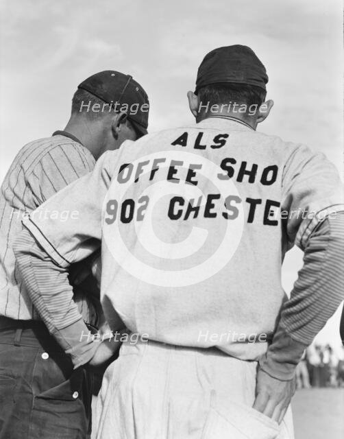 Watching ball game, Shafter migrant camp, California, 1938. Creator: Dorothea Lange.