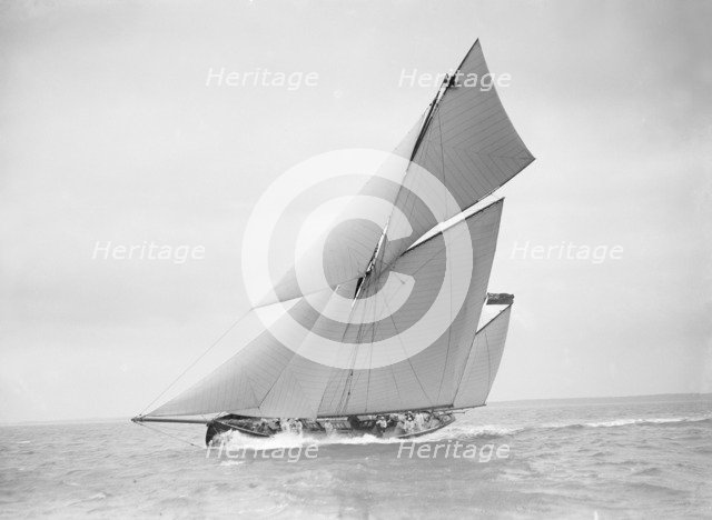 The yawl 'Joyce' sailing in good wind, 1911. Creator: Kirk & Sons of Cowes.