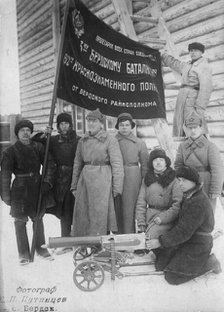 The banner of the Berdsk regional executive committee is held by the soldiers of the 3rd..., 1928. Creator: GP Putintsev.