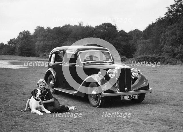 1938 Daimler DB18 with lady and her pet dog. Creator: Unknown.