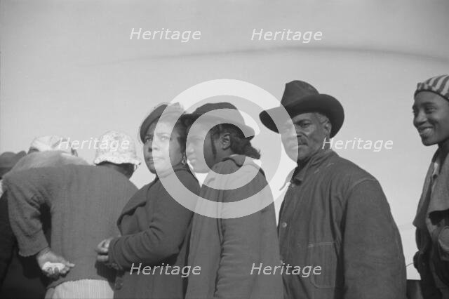 Possibly: Negroes in the lineup for food at mealtime in the camp..., Forrest City, Arkansas, 1937. Creator: Walker Evans.