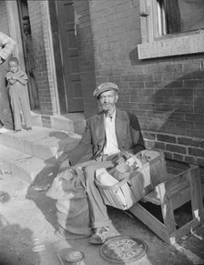 An old peanut vendor on Seaton Road, Washington, D.C., 1942. Creator: Gordon Parks.