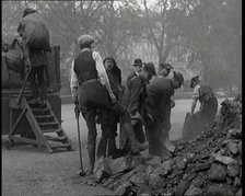 Male Civilian Volunteers Shovelling Heaps of Coal in Hyde Park London, 1926. Creator: British Pathe Ltd.