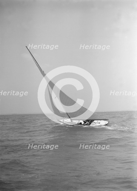 The 6 Metre class 'The Whim' sailing upwind, 1911. Creator: Kirk & Sons of Cowes.