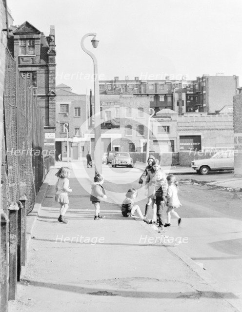 Children playing on Hopetown Street, London. Artist: Willson