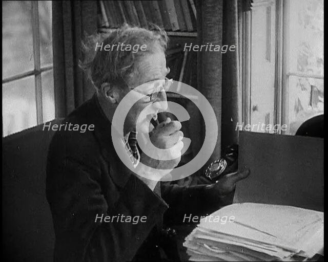 A.P. Herbert Inspecting Some Papers, 1930s. Creator: British Pathe Ltd.