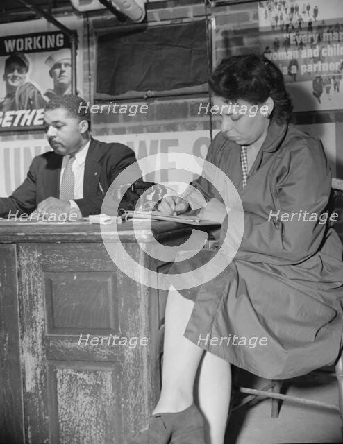 Air raid wardens' meeting in zone nine, Southwest area, Washington, D.C, 1942. Creator: Gordon Parks.