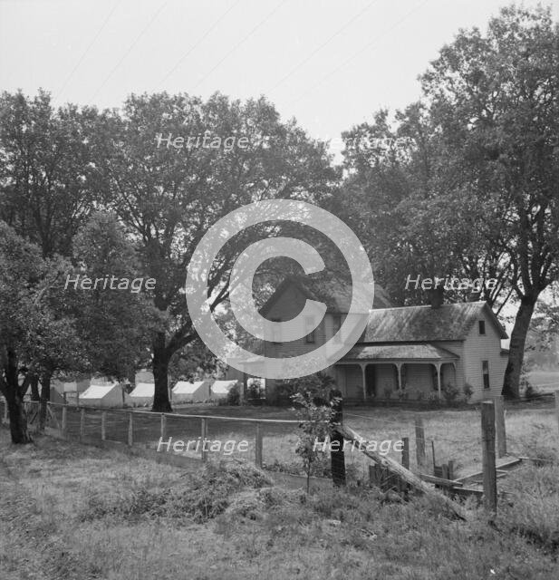 Hop grower's home on Rogue River, with the tent camp he..., near Medford, Jackson County, 1939. Creator: Dorothea Lange.