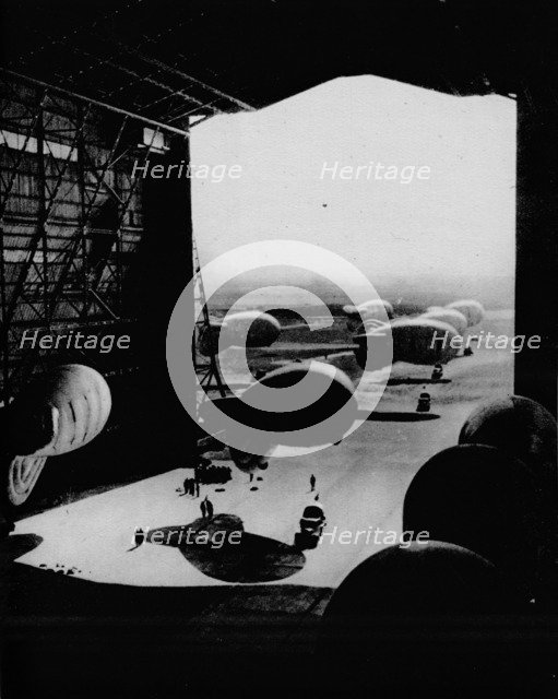 Putting barrage ballons into a hangar, 1943. Artist: Unknown.