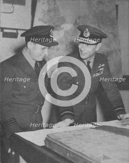 'H.M. The King learns details of the R.A.F. raid on the Ruhr dams on May 17, 1943', 1943-44. Artist: Unknown.