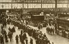 'A Queue of Holiday-Makers Waiting for Trains at Waterloo Station, London', 1930. Creator: Alfieri.