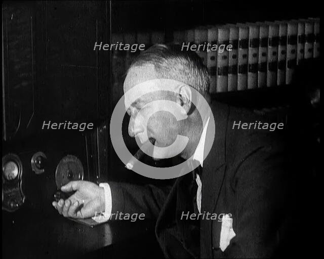 Al Smith, Former Presidential Candidate, Smoking a Cigar And Following Election Results..., 1932. Creator: British Pathe Ltd.