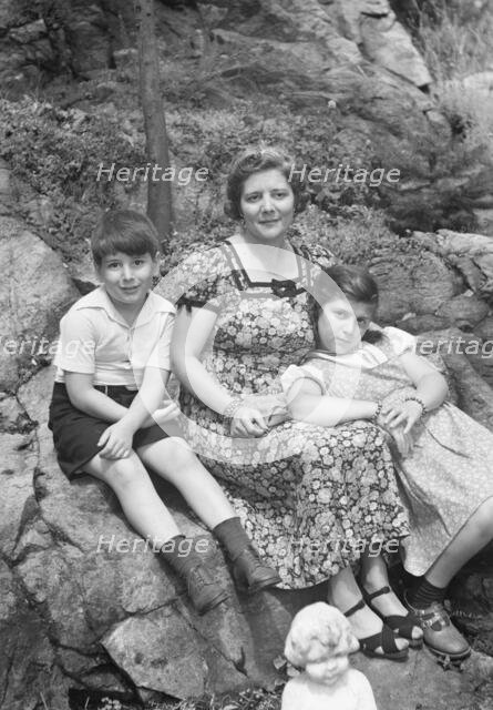 Javits, Benjamin, Mrs., and children, seated oudoors, ca. 1935. Creator: Arnold Genthe.