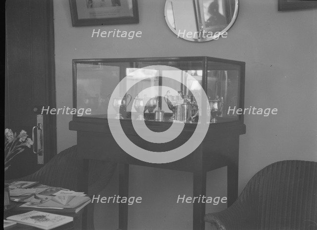 Cabinet containing motor racing trophies. Artist: Bill Brunell.