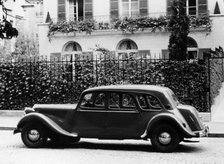 1954 Citroën 15CV Familiale parked outside a house. Artist: Unknown